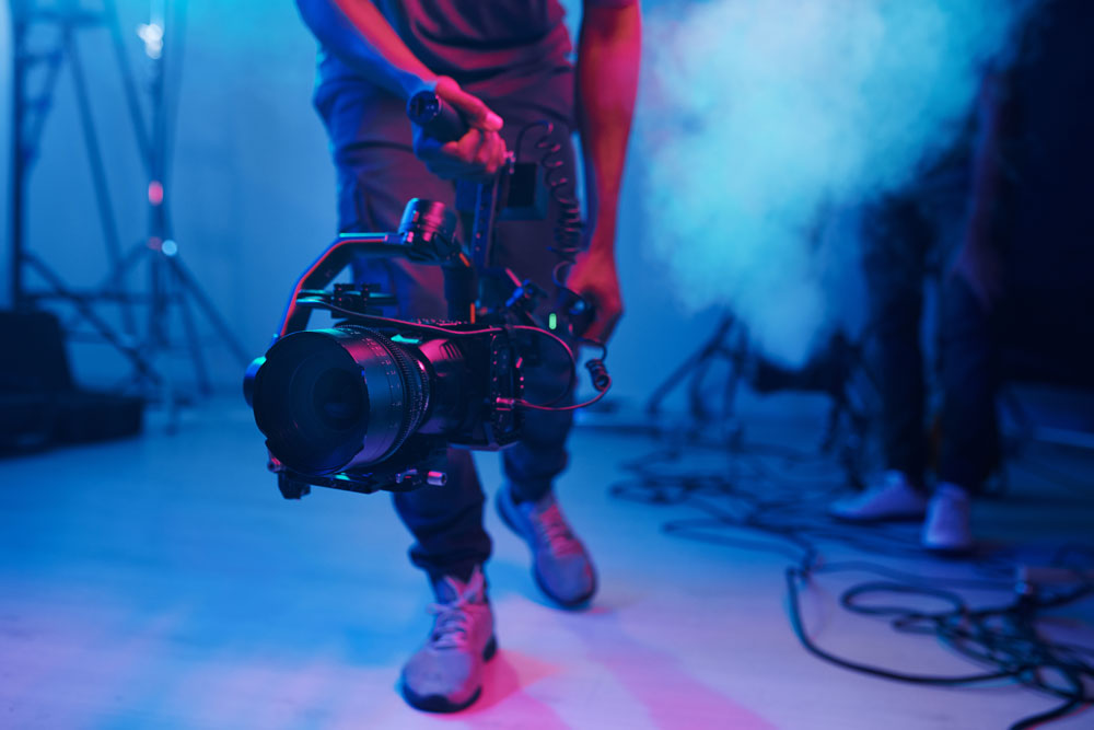 cameraman-using-professional-camera-in-shooting-2025-03-18-22-19-35-utc Dreambox Studio - Corporate video production company