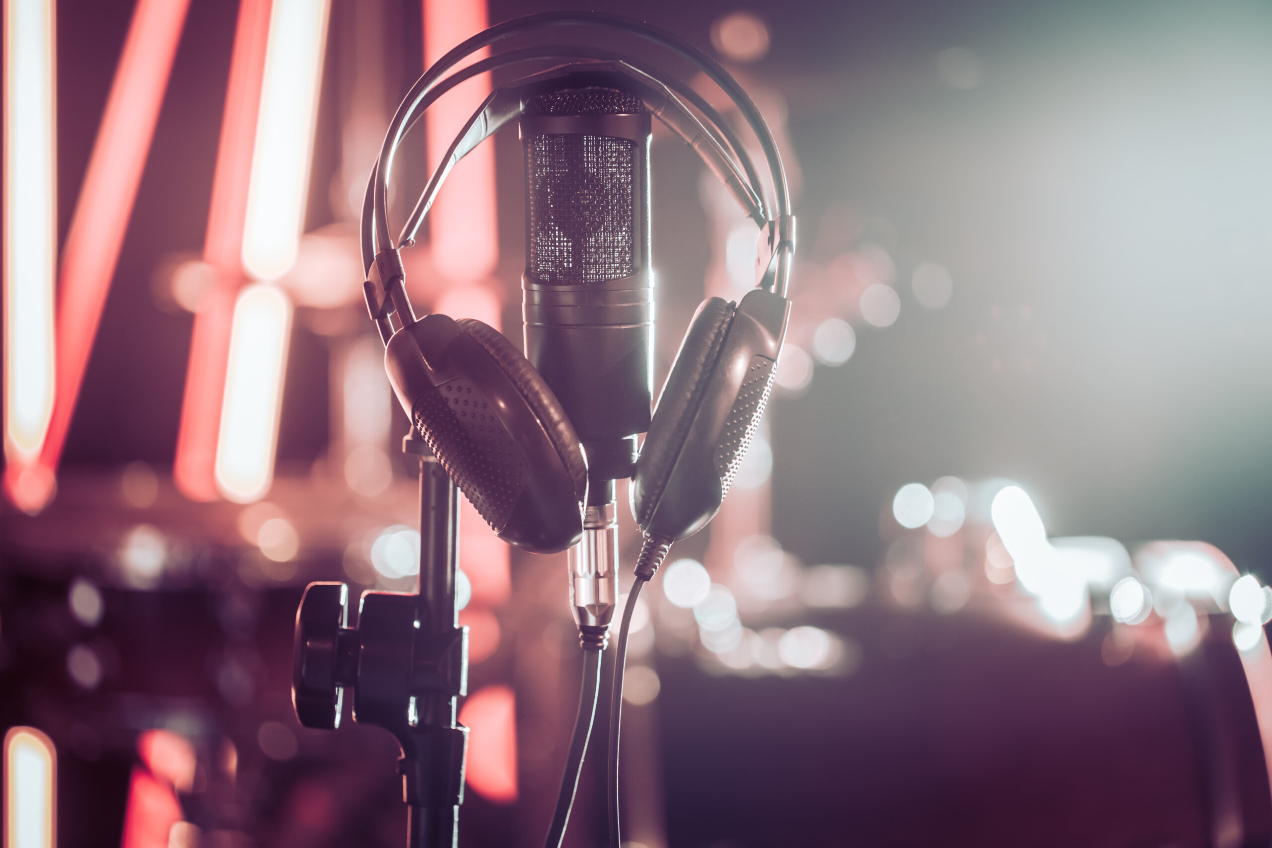Studio microphone and headphones on a close-up stand, in a recording Studio or concert hall. Dreambox Studio - Corporate video production company